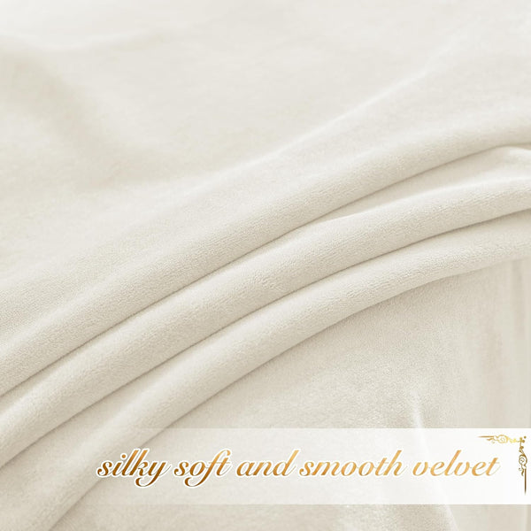 Close-up of light cream velvet fabric, showcasing its silky-soft and smooth texture with gentle folds.