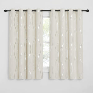 Cream grommet curtains featuring a modern metallic silver wavy pattern on a black rod.