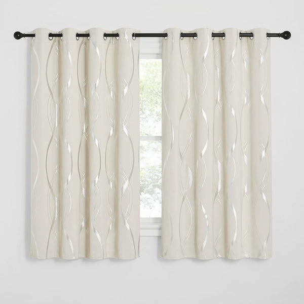 Cream grommet curtains featuring a modern metallic silver wavy pattern on a black rod.