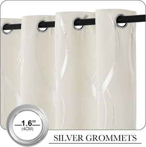 Cream blackout curtain panels with elegant silver wavy striped pattern and silver grommets.