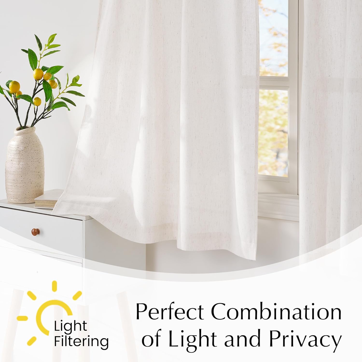 Textured cream sheer curtains on a window, filtering daylight for soft illumination and privacy.
