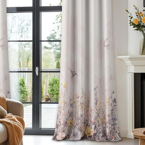 Full-length cream curtains with a graceful wildflower and flying bird pattern.