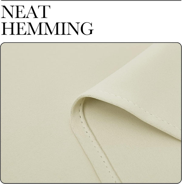 Close-up of cream woven fabric showing neat, consistent hemming and subtle texture.