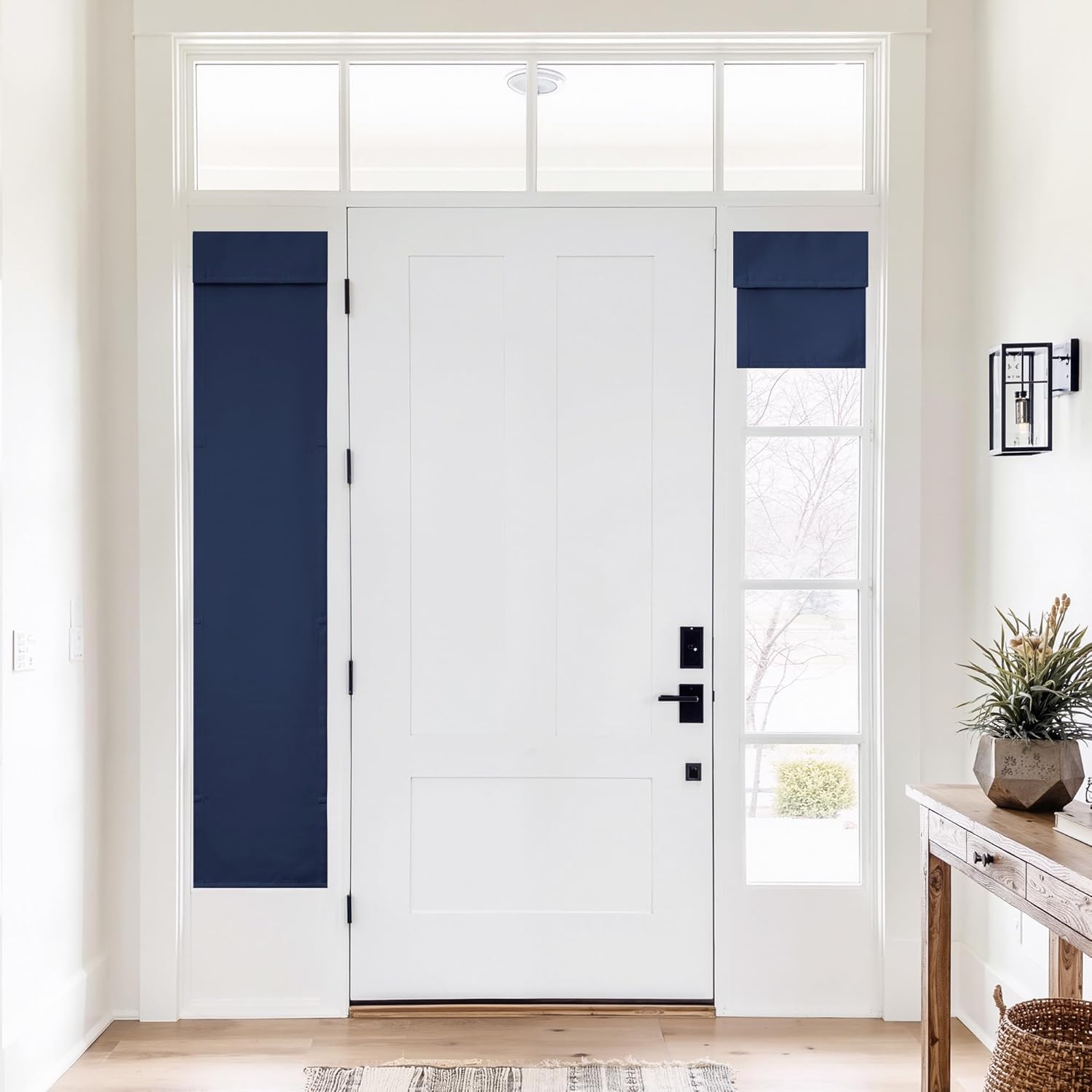 Dark blue magnetic window shades on sidelights of a white front door in a modern entryway.