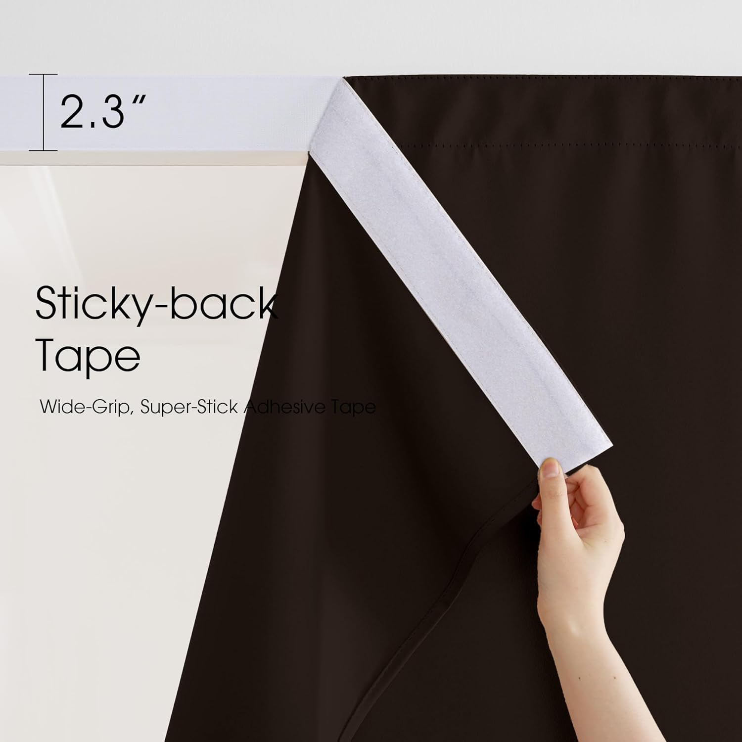 Dark brown room darkening curtain with a hand revealing wide-grip 2.3-inch sticky-back tape.
