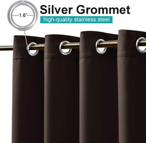 Close-up of dark brown blackout curtains with 1.6-inch silver stainless steel grommets on a golden rod.