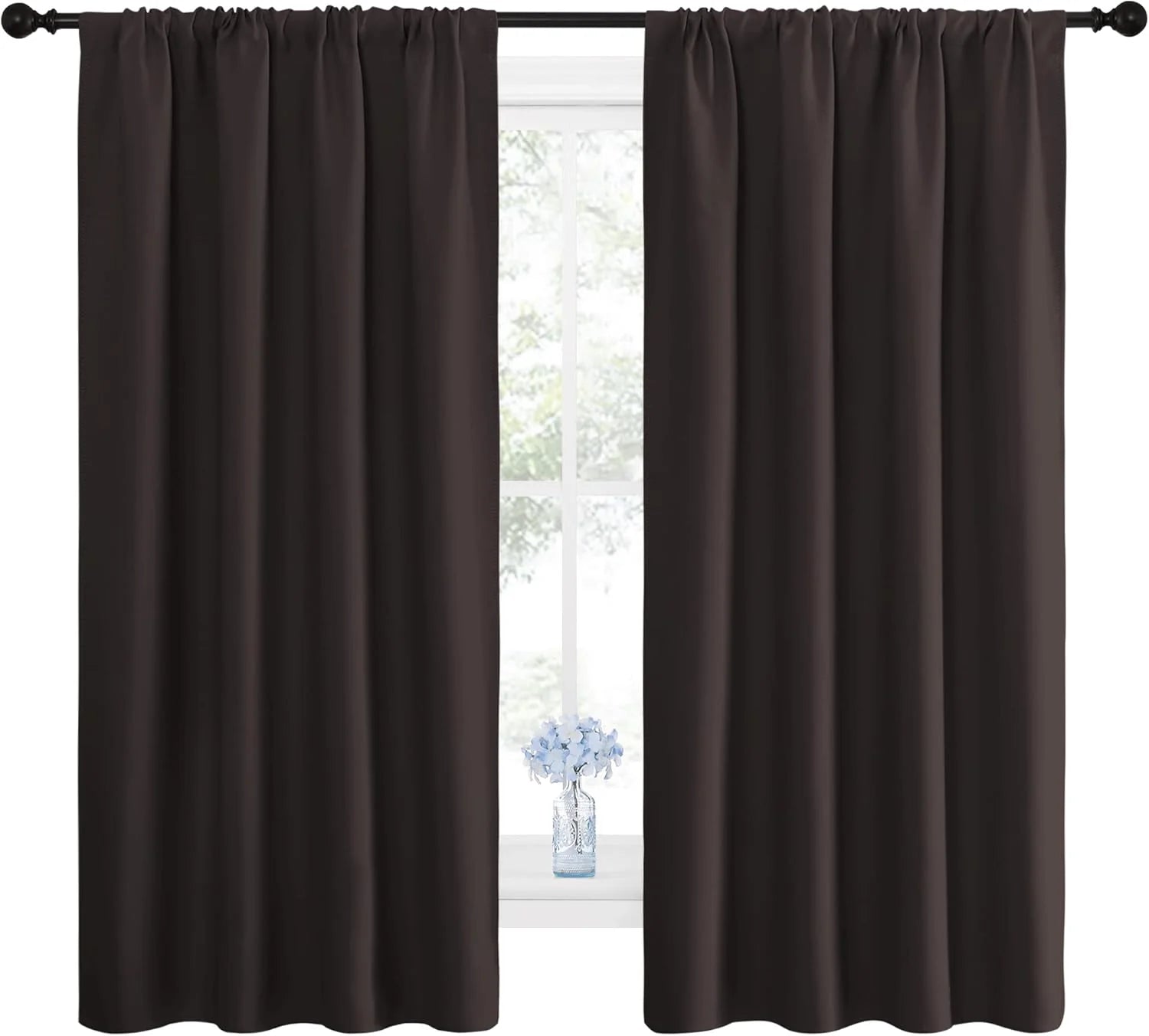 Dark brown blackout rod pocket curtains over window with blue flowers.