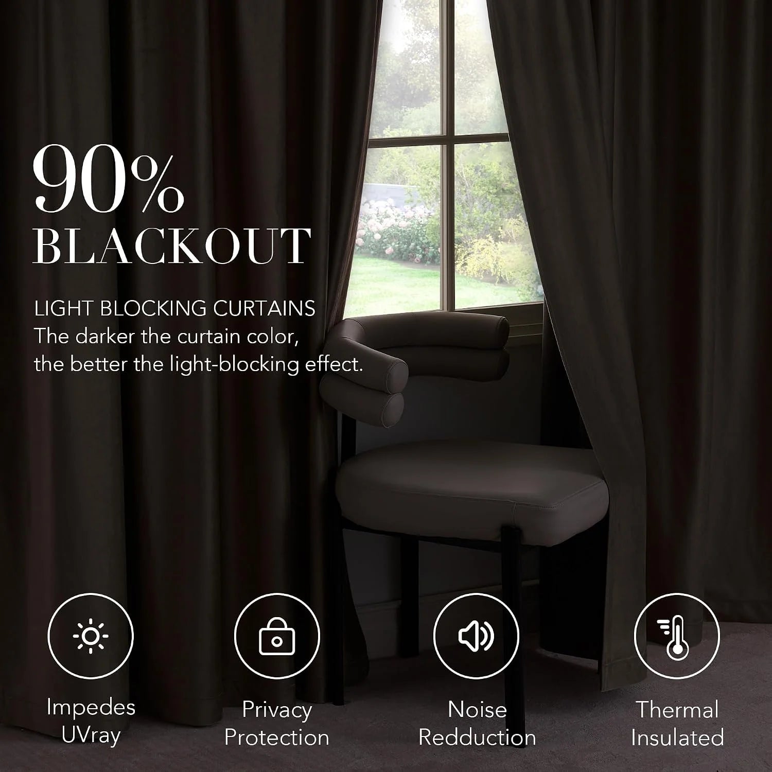 Dark brown blackout curtains framing a window beside a cushioned chair in a dim room