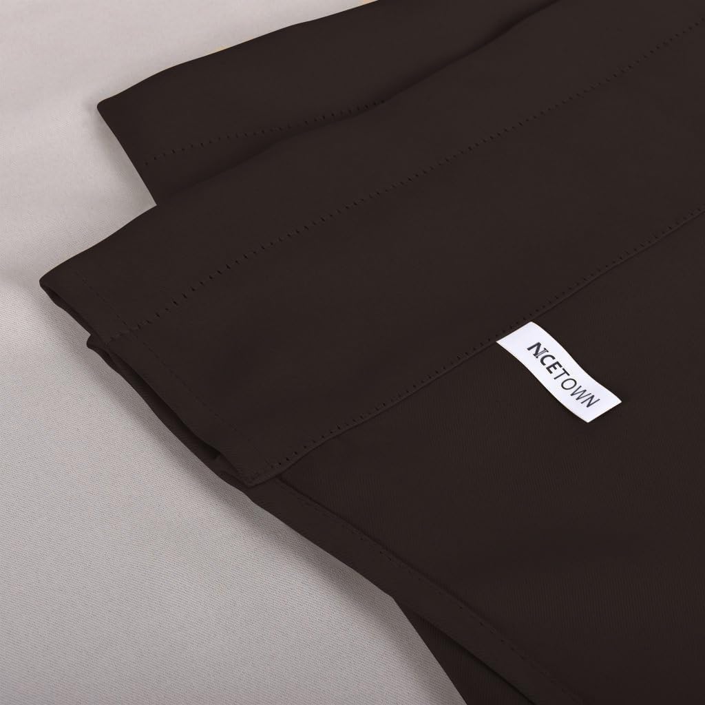 Detail of dark brown fabric from a NICETOWN curtain panel with a white brand tag and visible stitching.