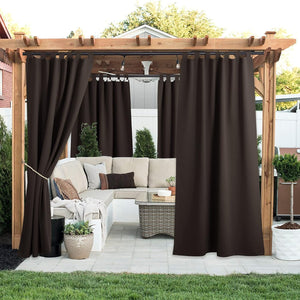 Dark brown tab top outdoor privacy curtains on a pergola, shading a patio lounge.