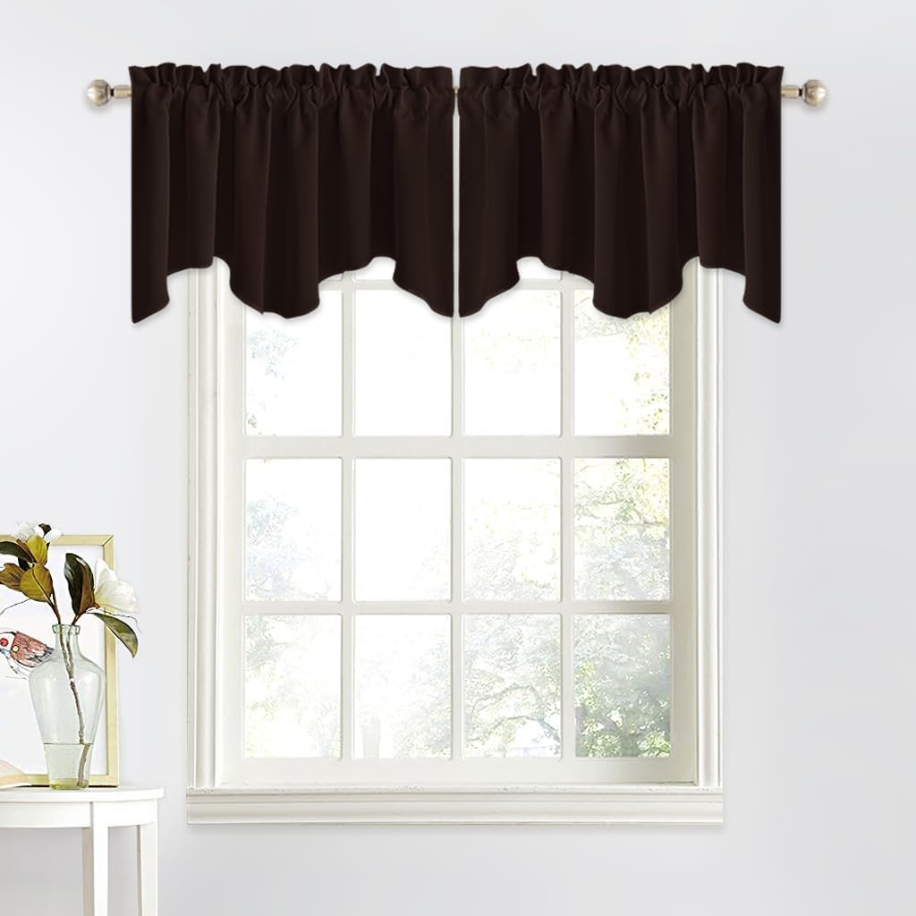 Dark brown scalloped valance with gathered rod pocket top, hung on a silver rod over a window.