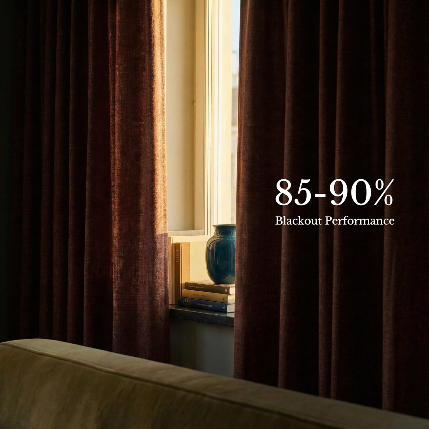Textured deep brown blackout curtains providing 85-90% light blockage at a sunlit window.