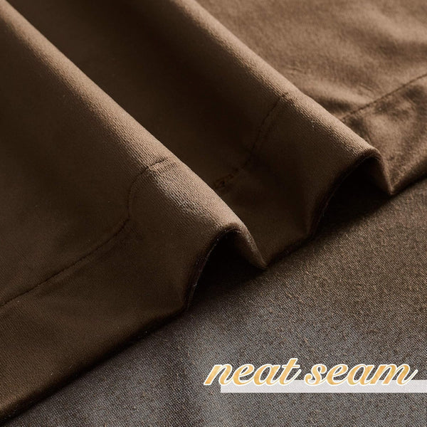 Close-up of dark brown thermal blackout curtain fabric, showing soft texture and a neat seam.