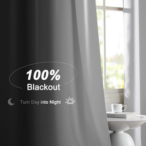 Dark gray 100% blackout curtain panel effectively blocks bright light from a sunny window.