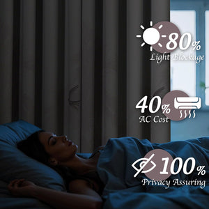 Dark gray bird pattern blackout curtains in a dim bedroom, providing light blockage and privacy.