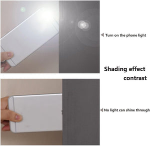 Visual comparison showing dark gray blackout fabric blocking light from a phone flashlight effectively.