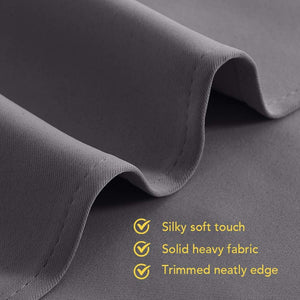 Close-up of a dark gray, heavy fabric panel, revealing its silky soft texture and a neatly finished edge.