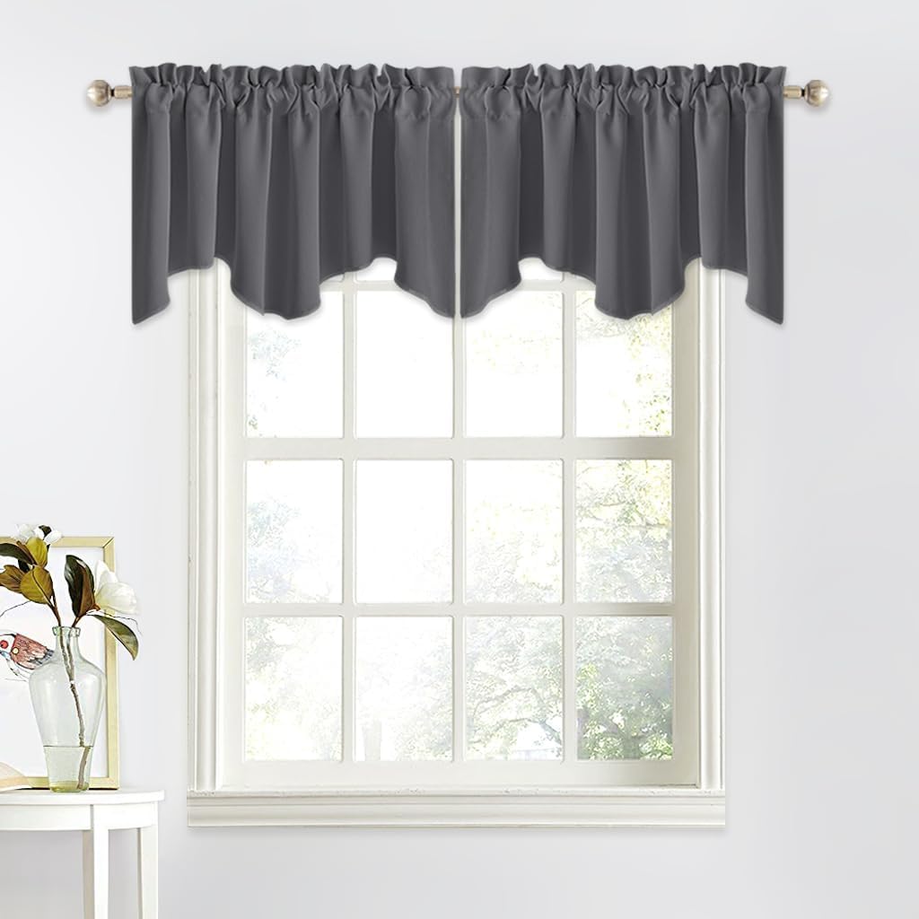 Charcoal gray fabric valance with a ruffled rod pocket and elegant scalloped hem above a white-framed window