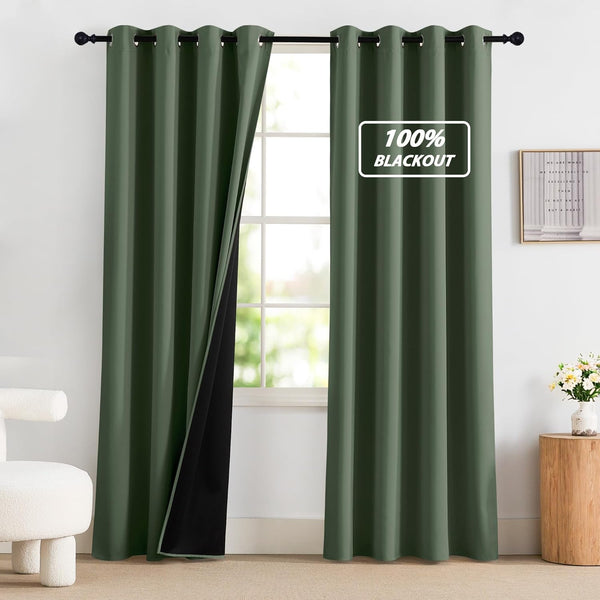 Dark green grommet top blackout curtains with black lining on a rod, partially open to show a bright window.