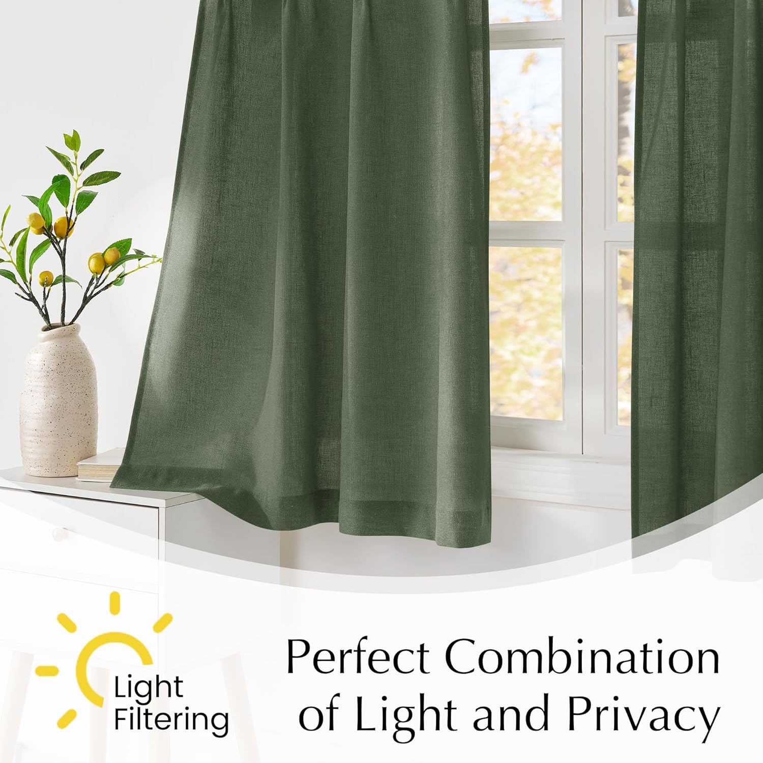 Dark green linen-look light filtering curtains with rod pocket top hanging over a sunlit window.