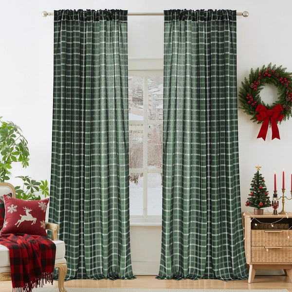 Dark green and white plaid rod pocket curtains hanging in a bright room with holiday decor.