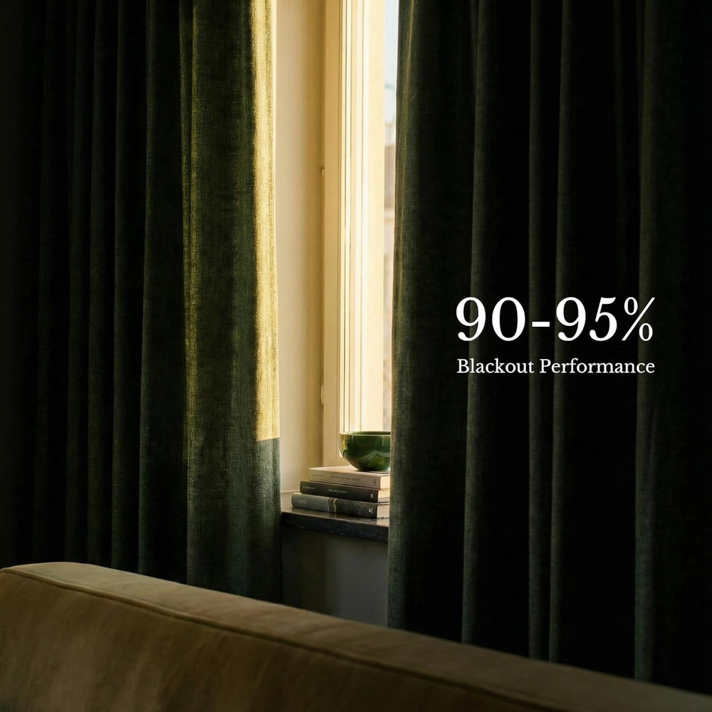 Dark green textured pinch pleat curtains hanging on a wooden rod in a modern living room