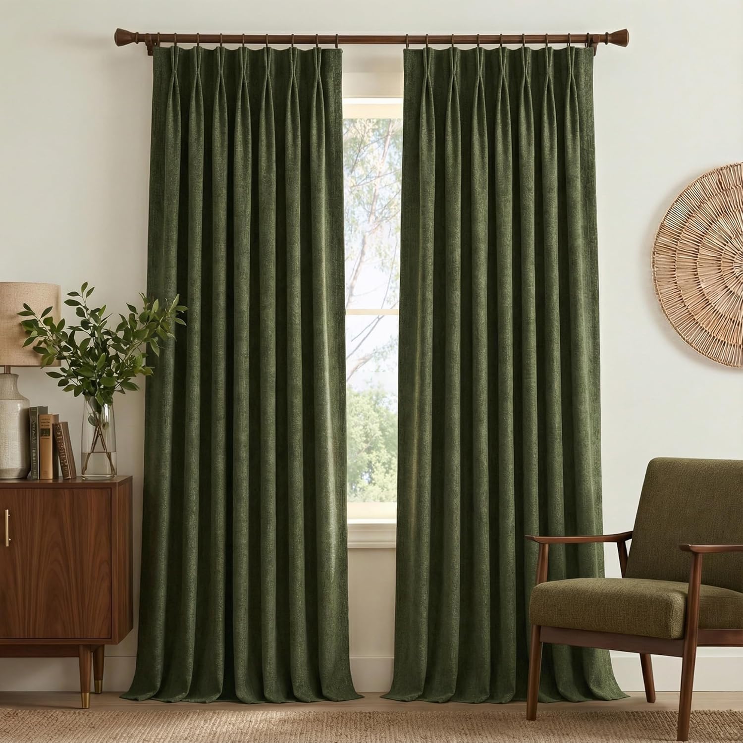 Dark green textured pinch pleat curtains hanging on a wooden rod in a modern living room