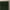 Rich dark green velvet pinch pleat curtain on a decorative brass rod.