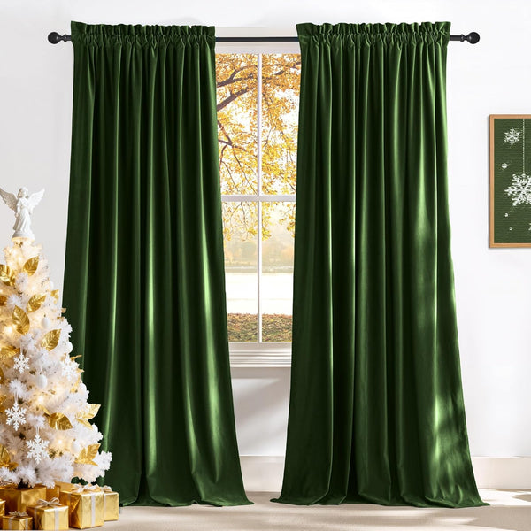 Plush dark green velvet rod pocket curtains hanging on a black rod, rich texture visible.