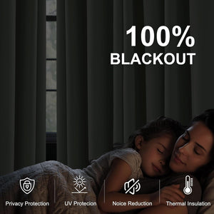 Dark grey 100% blackout curtains fully closed, creating a dark room for restful sleep.