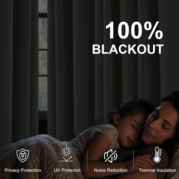 Dark grey 100% blackout curtains fully closed, creating a dark room for restful sleep.