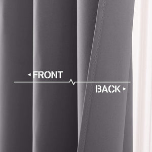 Close-up of dark grey blackout curtain showing smooth front and diagonally woven back fabric.