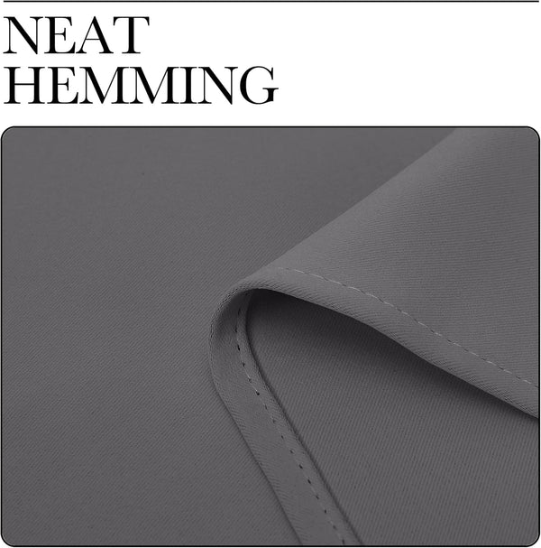 Close-up of dark grey fabric, likely a blackout curtain, highlighting the neat, even hemming with subtle diagonal texture.