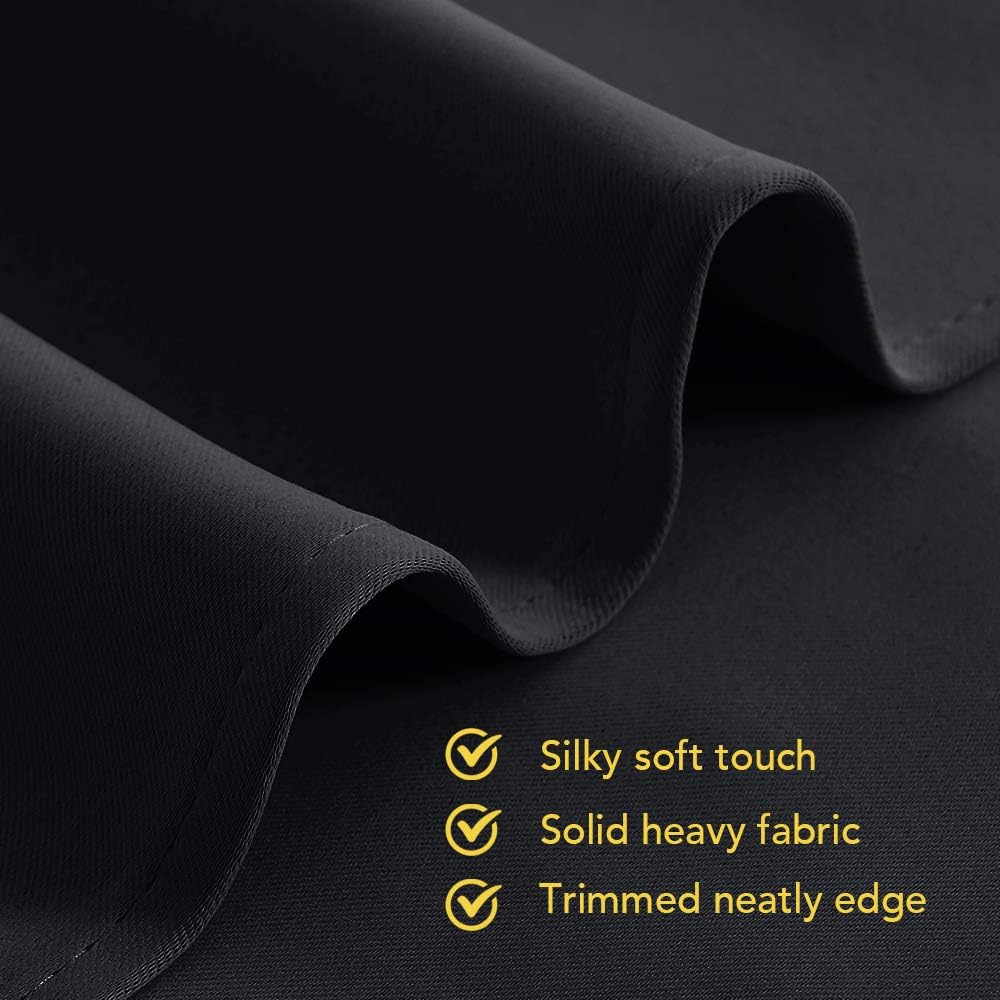 Dark grey fabric close-up with silky soft touch, solid heavy texture, and neatly trimmed edge.