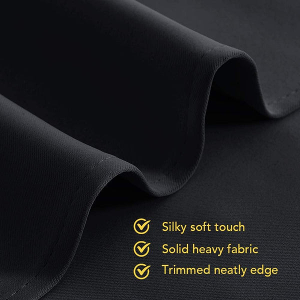 Dark grey fabric close-up with silky soft touch, solid heavy texture, and neatly trimmed edge.