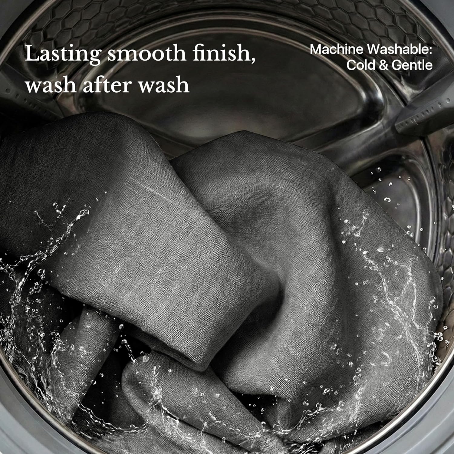 Dark grey textured fabric actively washing in a machine, highlighting its durable and smooth finish.