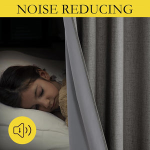 Dark grey textured noise-reducing curtain with blackout lining, ensuring quiet sleep for a child.