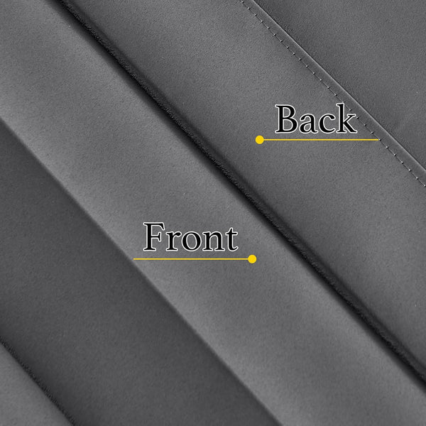 Close-up of a dark grey blackout fabric sample, showing its smooth front and stitched reverse side.