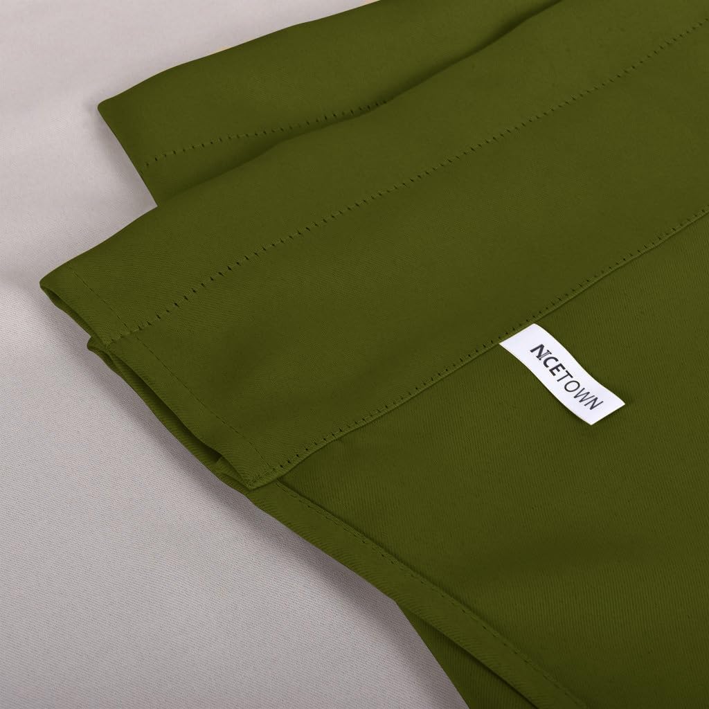 Close-up of a folded dark olive green blackout curtain panel with visible top stitching and "NCETOWN" label.