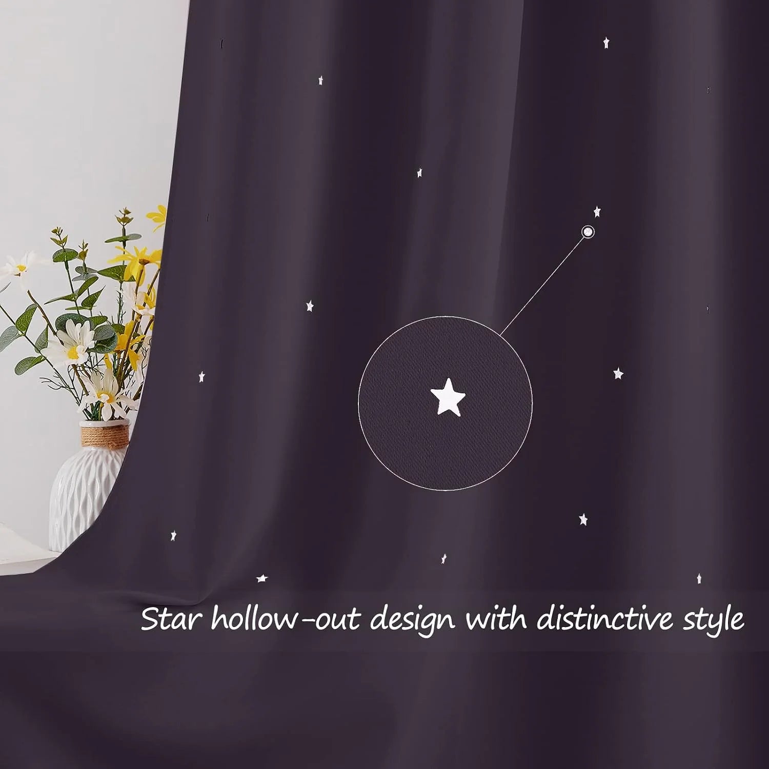 Dark purple curtain with small star cutout pattern beside a white vase of flowers