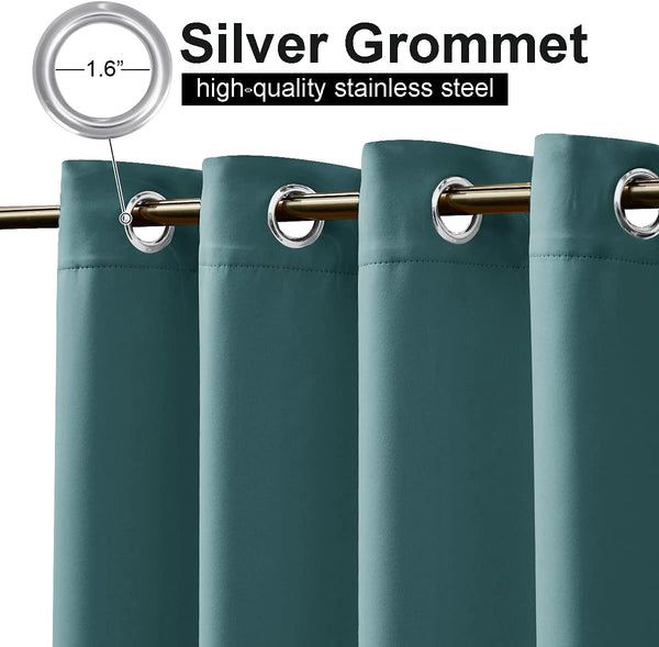 Close-up of dark teal blackout curtains with 1.6 inch silver grommets hanging on a golden rod.