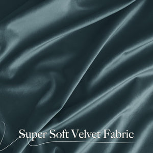 Close-up of luxurious dark teal super soft velvet fabric with gentle folds, highlighting its plush texture.