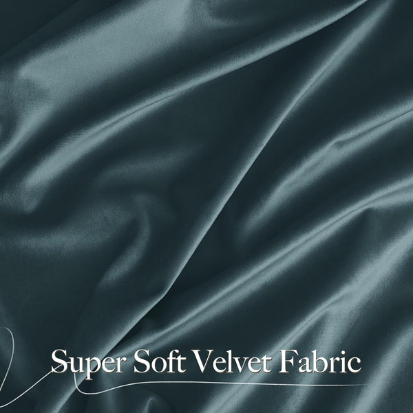 Close-up of luxurious dark teal super soft velvet fabric with gentle folds, highlighting its plush texture.