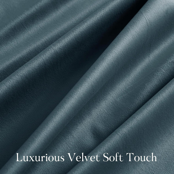 Close-up of a luxurious dark teal velvet fabric, highlighting its soft, plush texture and gentle folds.