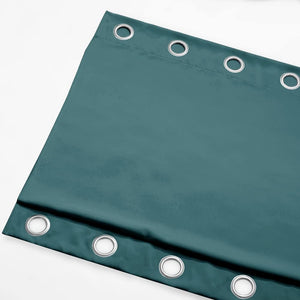 Deep teal velvet grommet top curtain panel, showcasing a plush fabric texture.