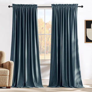 Rich dark teal velvet curtains with gathered rod pocket top drape elegantly over a window.