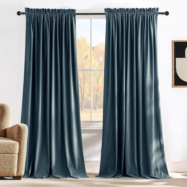 Rich dark teal velvet curtains with gathered rod pocket top drape elegantly over a window.