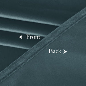Close-up of dark teal dual-sided fabric, showing soft velvet front and textured woven back.