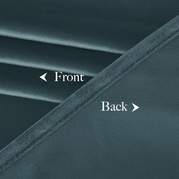 Close-up of dark teal dual-sided fabric, showing soft velvet front and textured woven back.