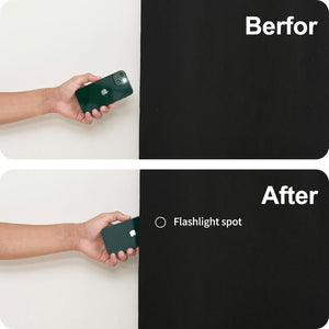 Demonstration: hand shines green iPhone flashlight on black material; light absorbed, no visible spot.